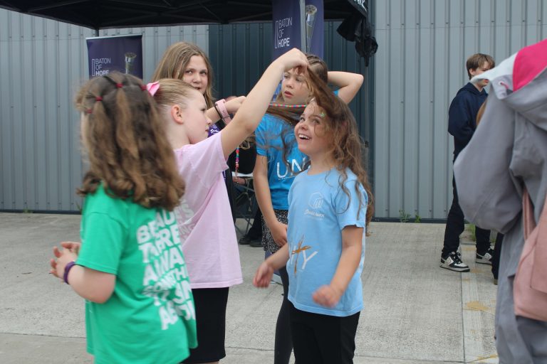 children dancing at the music box IV launch