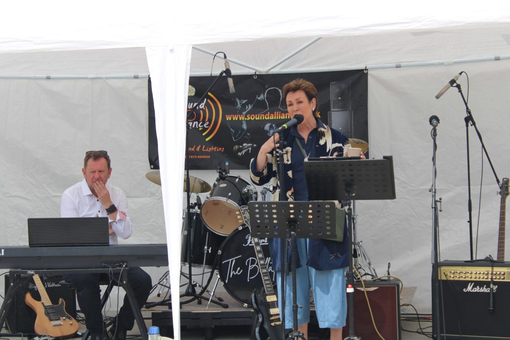 Christa Ackroyd performing on stage at the official launch of music box IV